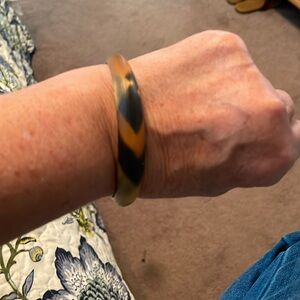 Beautiful Alexis Bitar lite bracelet. Tones of black, gold, and orange.